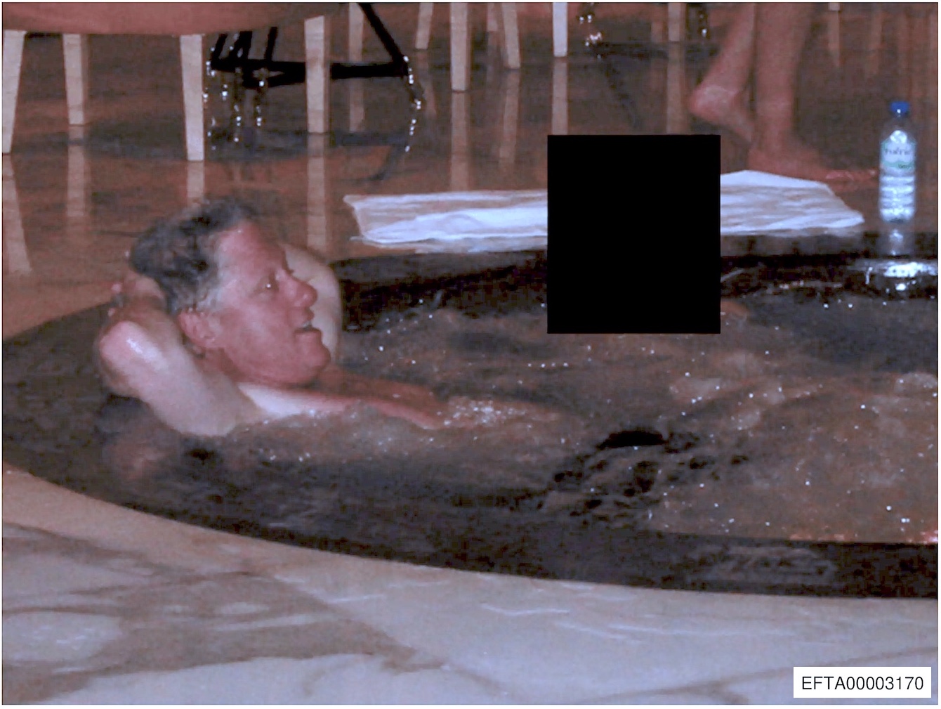EFTA00003170-sm (Bill Clinton relaxes in the swimming pool)